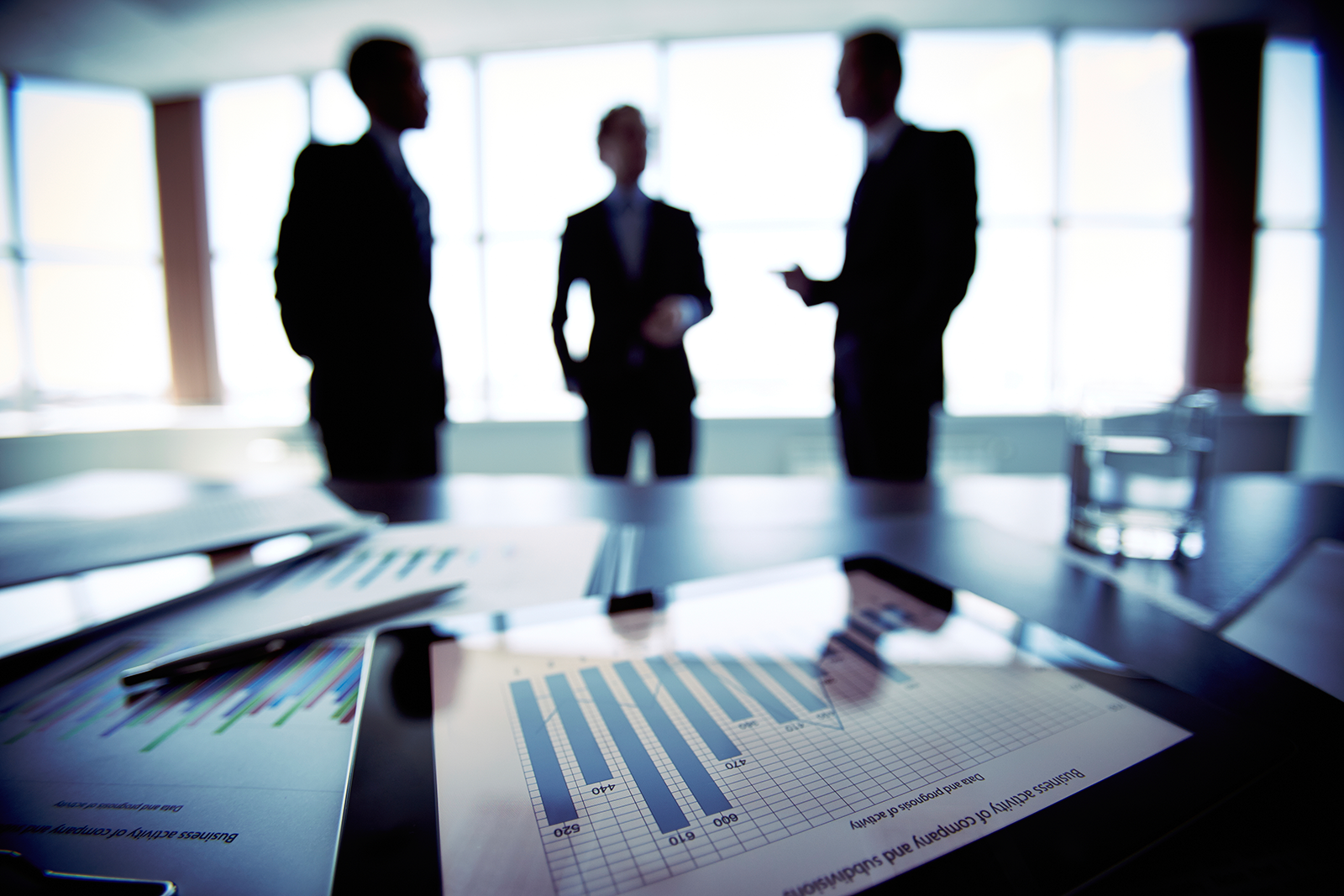 Business people around a conference table.