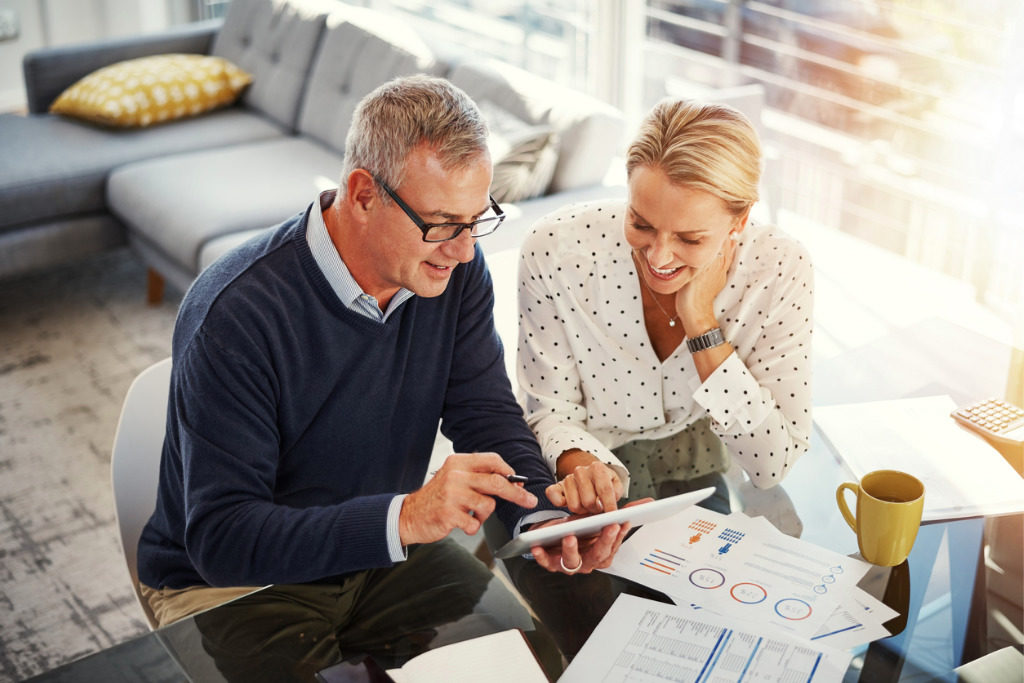 A couple looks over their retirement plans together.